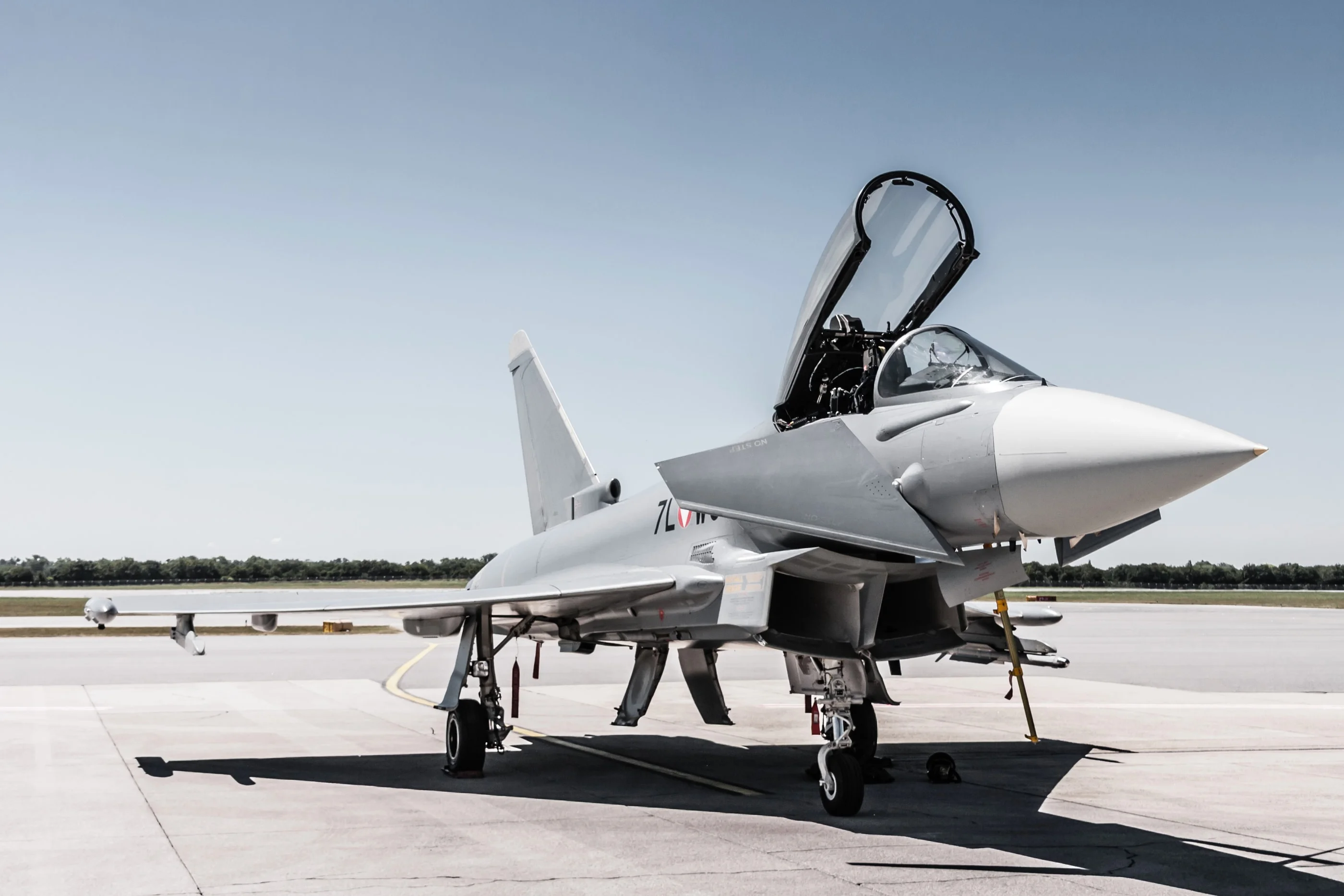 Eurofighter with its canopy open, parked on the apron at Vienna airport