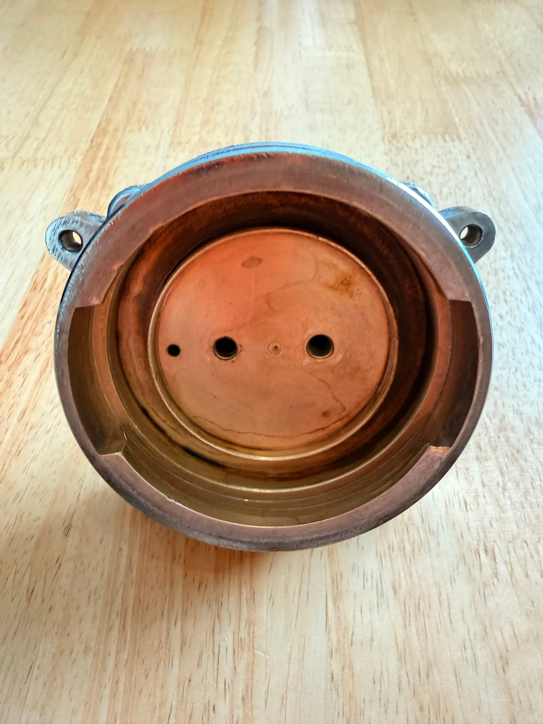 The same bowl on the morning of 19 July after warm citric acid: bright pink-brown metal again, the passages to the shower screen clear