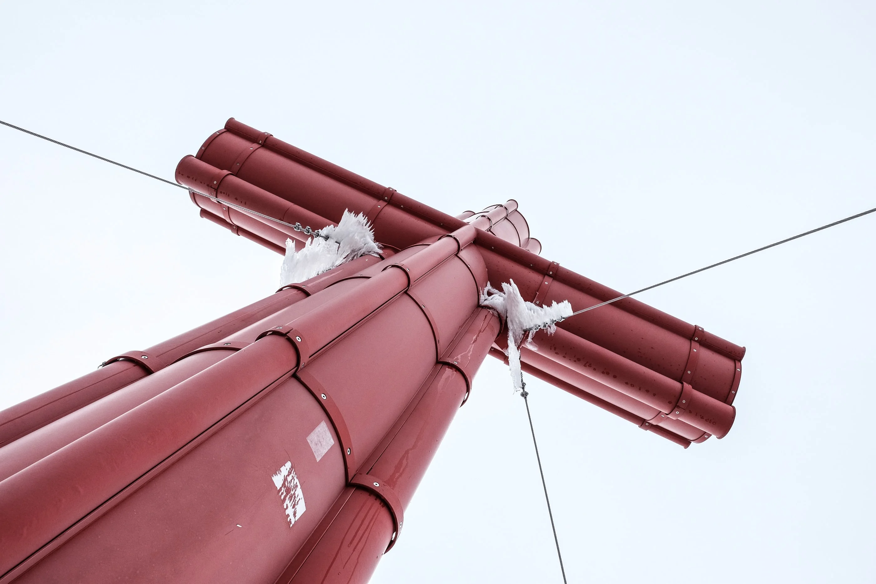 The red summit cross of the Großer Priel seen from below with its guy wires